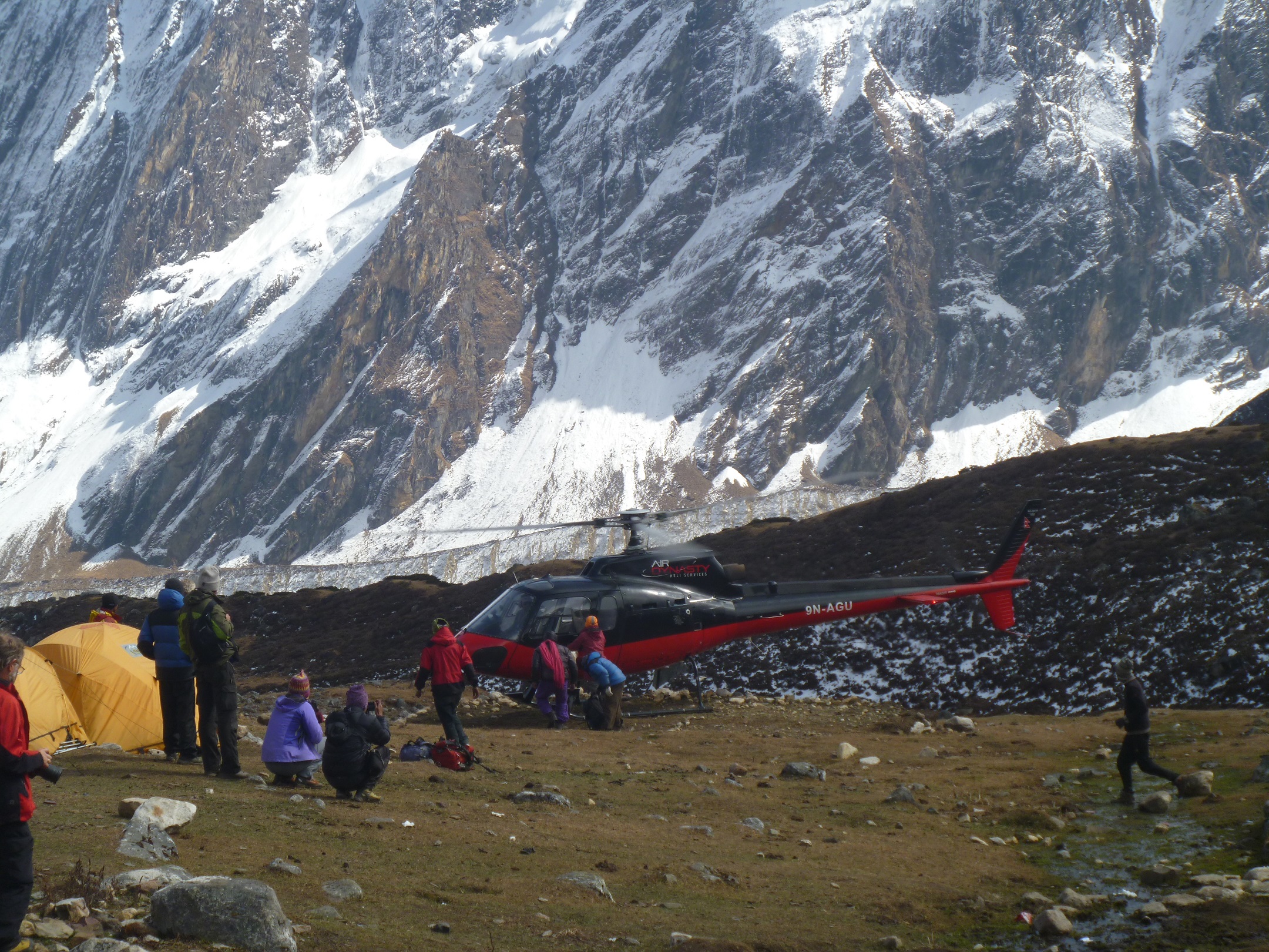 Adventurers engaged in Larke Peak Climbing, navigating snowy ridges and ice slopes with breathtaking Himalayan views in the background.