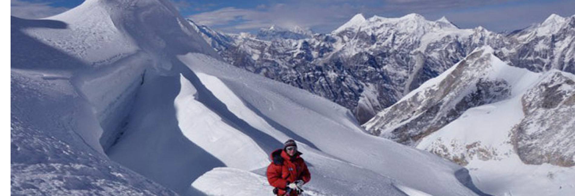 Climbers ascending Larke Peak Climbing with panoramic views of the Manaslu Himalayas in Nepal.