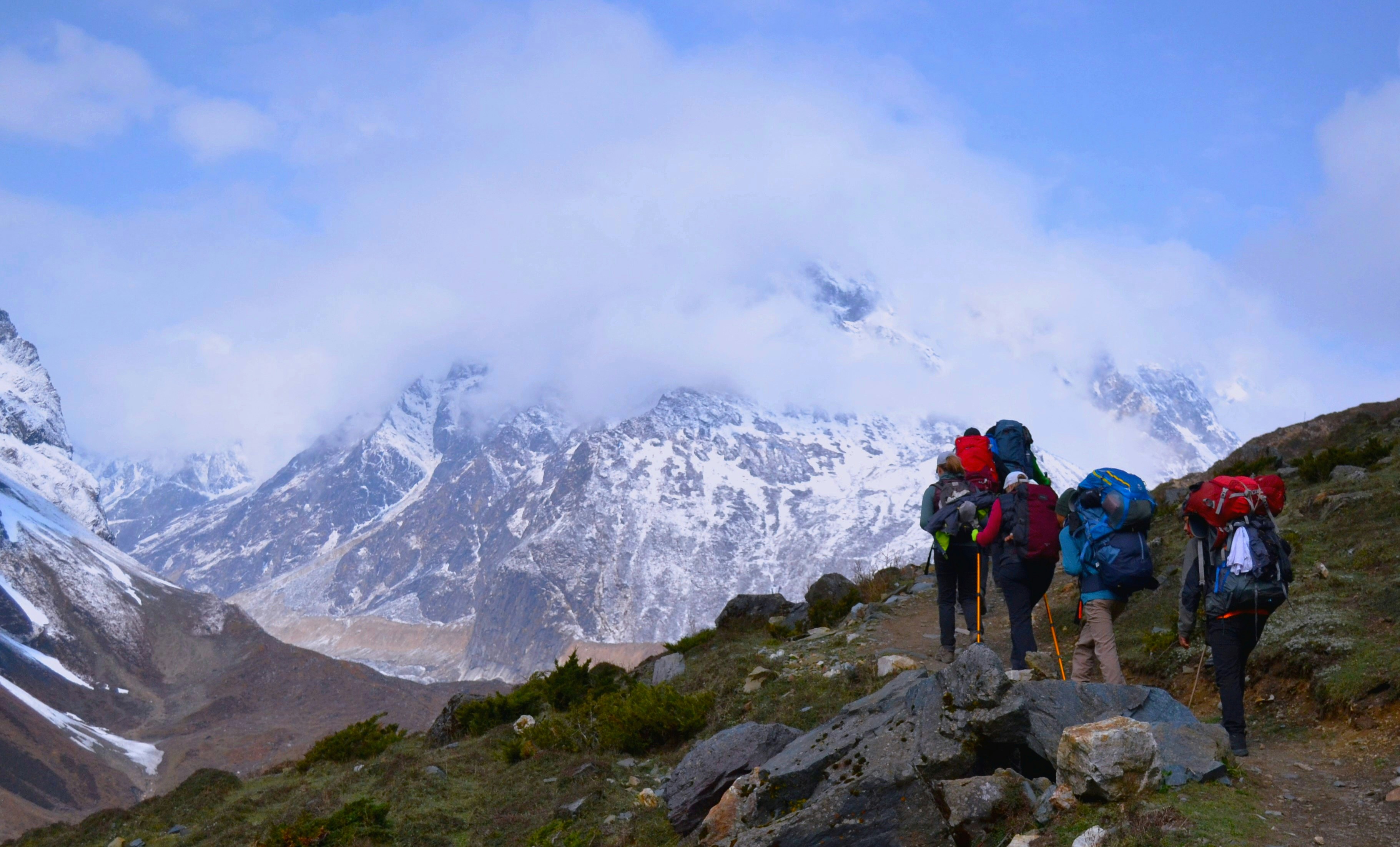Trekkers on the Short Manaslu Circuit Trek with Himalayan peaks