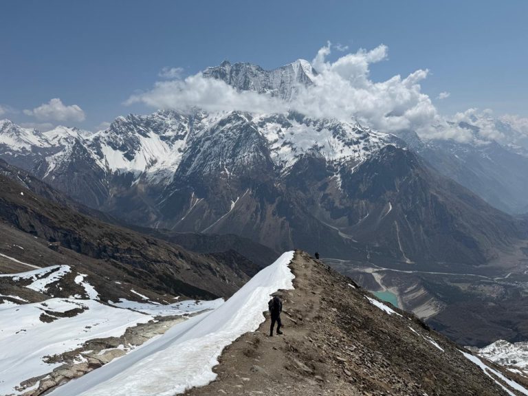 Trail toward Manaslu Base Camp with panoramic Himalayan mountain scenery.